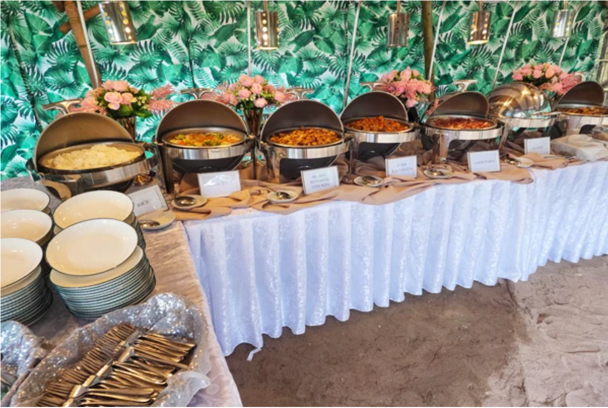 Essentials catering buffet setup with chafing dishes and tablewares